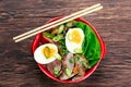 Duck noodles with egg, vegetables and duck meat in bowl