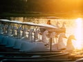 Duck pedal boat is lined up in the sunset. water bicycles locked on the lake in a sunny autumn day . Royalty Free Stock Photo