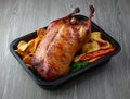 Duck roast on grey table