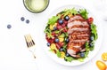 Duck slices salad with grilled breast and bloody orange, kumquat, blueberry and chard, frisse, mizuna, arugula leaves on white Royalty Free Stock Photo