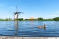 Duck swimming through a lake in Kinderdijk, the Netherlands