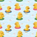 Ducklings with rubber rings seamless pattern