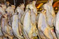 Ducks hanging on rack showcase in restaurant`s kitchen
