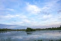 Duckweed covered lake kiovo, moscow region, russia, Orthodox church on the shore overgrown with reeds at summer evening