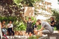 Dude with sign - woman stands protesting things that annoy her