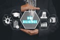 Business person hand holding due diligence icon on virtual screen