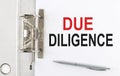 DUE DILIGENCE text on the paper folder with pen. Business concept
