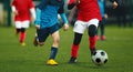 Duel of two young soccer players. Football match for kids. Training and football soccer tournament for children Royalty Free Stock Photo