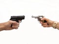 Dueling handguns Royalty Free Stock Photo