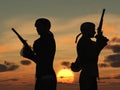 Duellists silhouetted against the rising sun Royalty Free Stock Photo