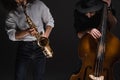 duet of jazzmen playign cello and sax