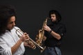 duet of musicians playing trumpet and saxophone