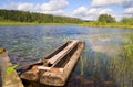 Dug-out in small forest lake