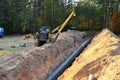 A Dug trench in the ground for the installation and installation of industrial gas and oil pipes. Royalty Free Stock Photo