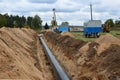 A Dug trench in the ground for the installation and installation of industrial gas and oil pipes. Royalty Free Stock Photo