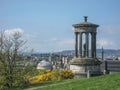 Dugald Stewart Monument with green vegetation around, in Edinburgh