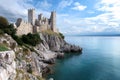 Duino Castle rising on the cliff overlooking the Sistiana Bay Royalty Free Stock Photo