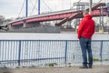 Duisburg , Germany - January 08 2017 : Tourist observing the the river Rhine flooding the promenade in Ruhrort