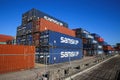 View on stack steel freight containers at german rhine inland port against blue sky