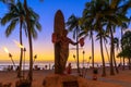 Duke Kahanamoku iconic statue at sunset in Waikiki beach Royalty Free Stock Photo