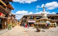 Dukezong old town street view with Tibetan stupa and blue sky in Shangri-La Yunnan China