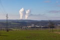 Dukovany nuclear power plant in the Czech Republic, Europe. Smoke cooling towers. There are clouds in the sky. In the foreground Royalty Free Stock Photo