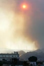 Dull sun shining through smoke from forest fire in Spain Royalty Free Stock Photo