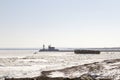 Visitors exploring The Crib on frozen Lake Superiorwith lighthouse on shipping pier in Duluth, Minnesota Royalty Free Stock Photo