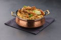 Dum chicken biriyani on a rustic background Royalty Free Stock Photo