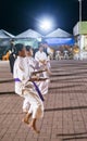Teenage Filipina girls,practice Karate moves outside at night,on Rizal Boulevard