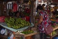 Dumaguete, the Philippines - 27 July 2018: Philipine woman buys fruits and vegetables on local market store.