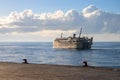 Dumaguete, the Philippines - 10 Mar 2020: cargo ferry in sea, view from port. Maritime shipping and delivery service