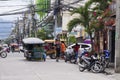 Dumaguete, Philippines: 13 May 2017: city street view with local transport and people.