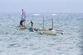 Dumaguete, Philippines - 13 May 2017: sea landscape with boats and local sailors. Traditional fishing boat in sea Royalty Free Stock Photo