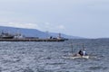 Dumaguete, Philippines - 13 May 2017: sea landscape with boats and local sailors. Royalty Free Stock Photo