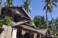 Dumaguete, Philippines - 1 Nov 2017: Souvenir shop with native decoration. Rustic tribal house with dry leaf roof.