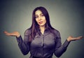 Dumb looking woman arms out shrugs shoulders Royalty Free Stock Photo