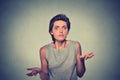 Dumb looking woman arms out shrugs shoulders Royalty Free Stock Photo