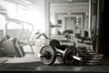 Dumbbell, barbell and workout in the gym. Copy space for text or decoration. Royalty Free Stock Photo