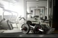 Dumbbell, barbell and workout in the gym. Copy space for text or decoration.