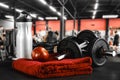 Dumbbell, barbell and workout in the gym. Space for products and decorations or text with blurred gym background.