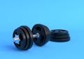 Dumbbell with black plates isolated on blue background Royalty Free Stock Photo