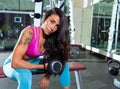 Dumbbell concentrated biceps curl girl woman Royalty Free Stock Photo