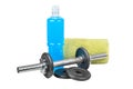 Dumbbell with pancakes, towel and plastic bottle of blue isotonic drinks