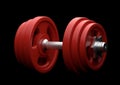 Dumbbell with red plates isolated on black background Royalty Free Stock Photo