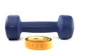 Dumbbell and sartorial meter Royalty Free Stock Photo
