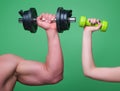 Dumbbell workout isolated green studio background. Hands with dumbbells close-up. Training with Dumbbells. Female and Royalty Free Stock Photo