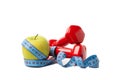 Dumbbells, apple and measuring tape isolated on background Royalty Free Stock Photo