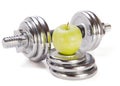 Dumbbells and green apple on white background Royalty Free Stock Photo