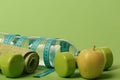 Dumbbells in green color, water bottle, measure tape, towel, fruit Royalty Free Stock Photo